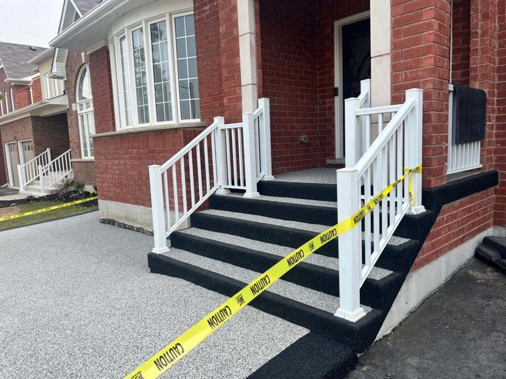 Grey and black rubber surfacing on a residential porch and steps in Oshawa