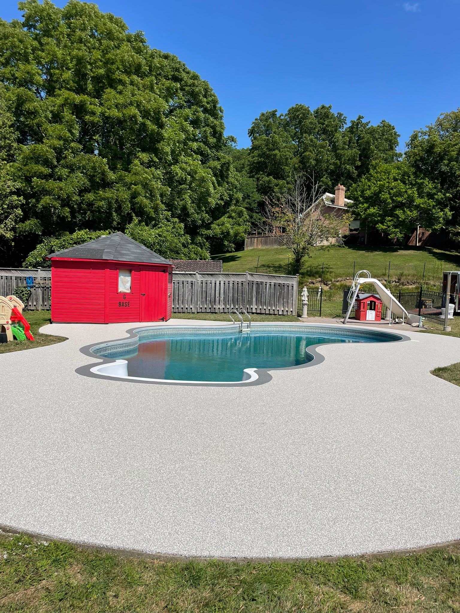 Completed poured rubber pool deck by Rubber Decker in Barrie Ontario