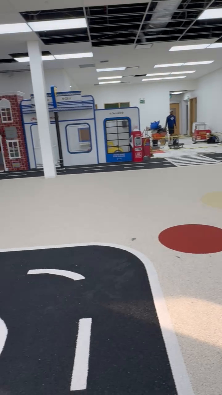 Indoor play flooring with white road markings at Beyond Play in Barrie